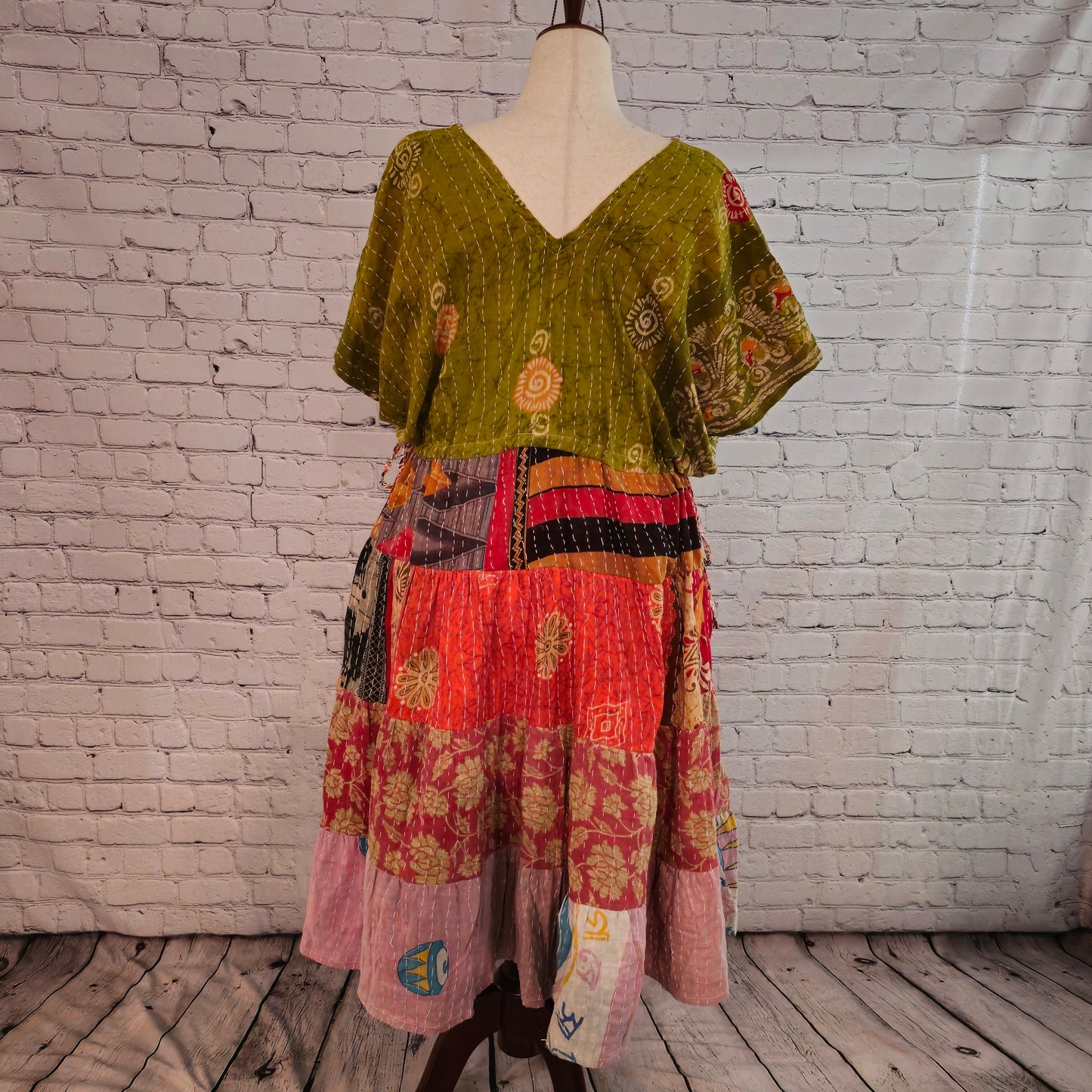 Twillow Harvest Glow Kantha Midi Dress with olive green bodice and warm yellow, red, and pink patchwork panels featuring Kantha stitching.