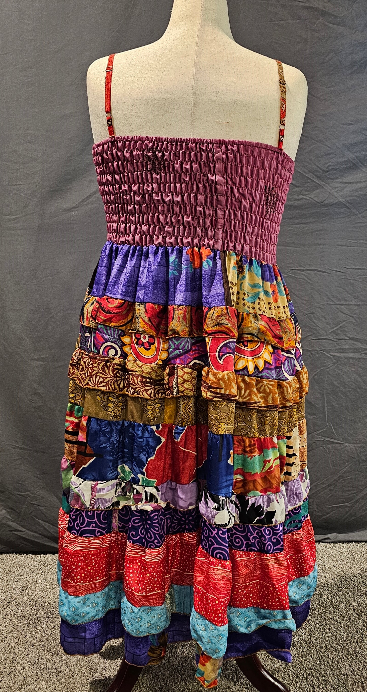 Meadowlark boho patchwork tiered dress in berry, violet, and gold, one-of-a-kind sustainable fashion.