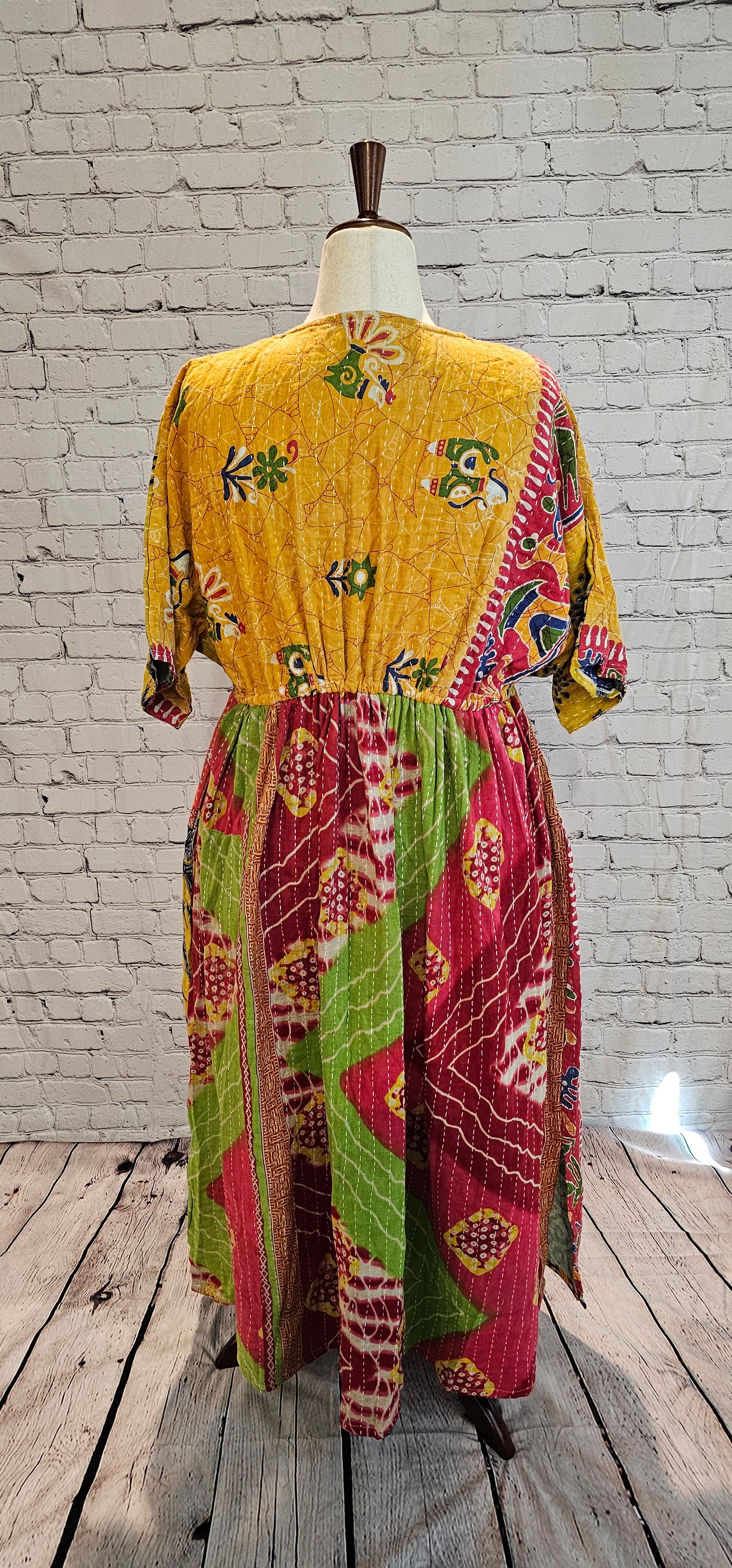 Bohemian cotton Kantha dress styled casually, one-of-a-kind patchwork garment shown on mannequin.