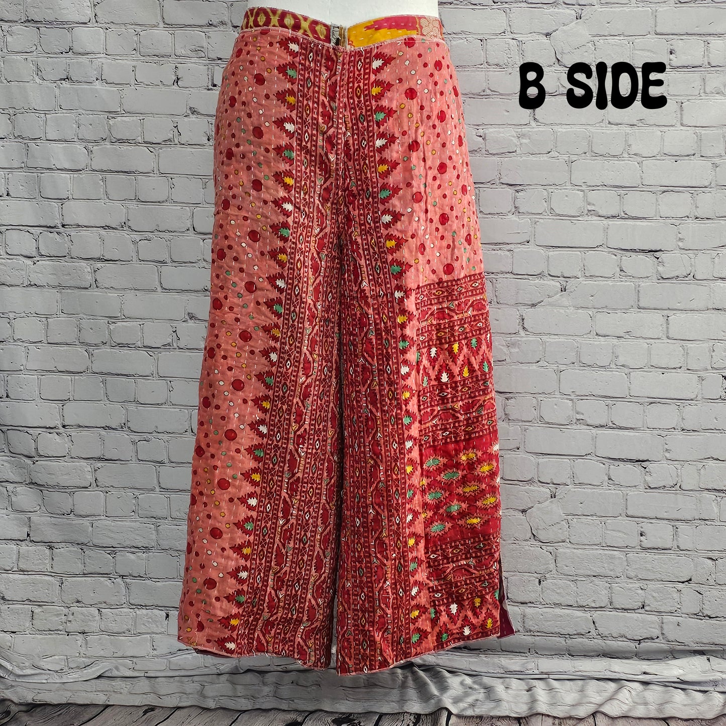 Back view of Ronin Kantha unisex wrap pants, recycled sari patchwork design in boho style.
