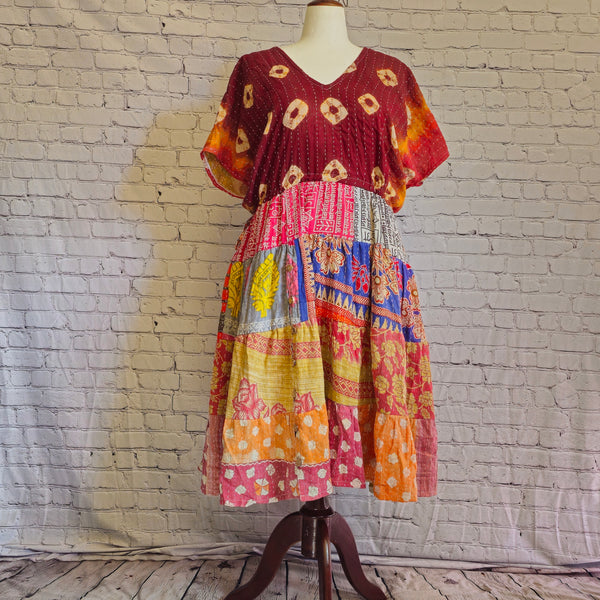 Twillow Sunset Reverie Kantha Midi Dress featuring maroon and multicolor boho patchwork panels, V-neck, and Kantha stitching accents.