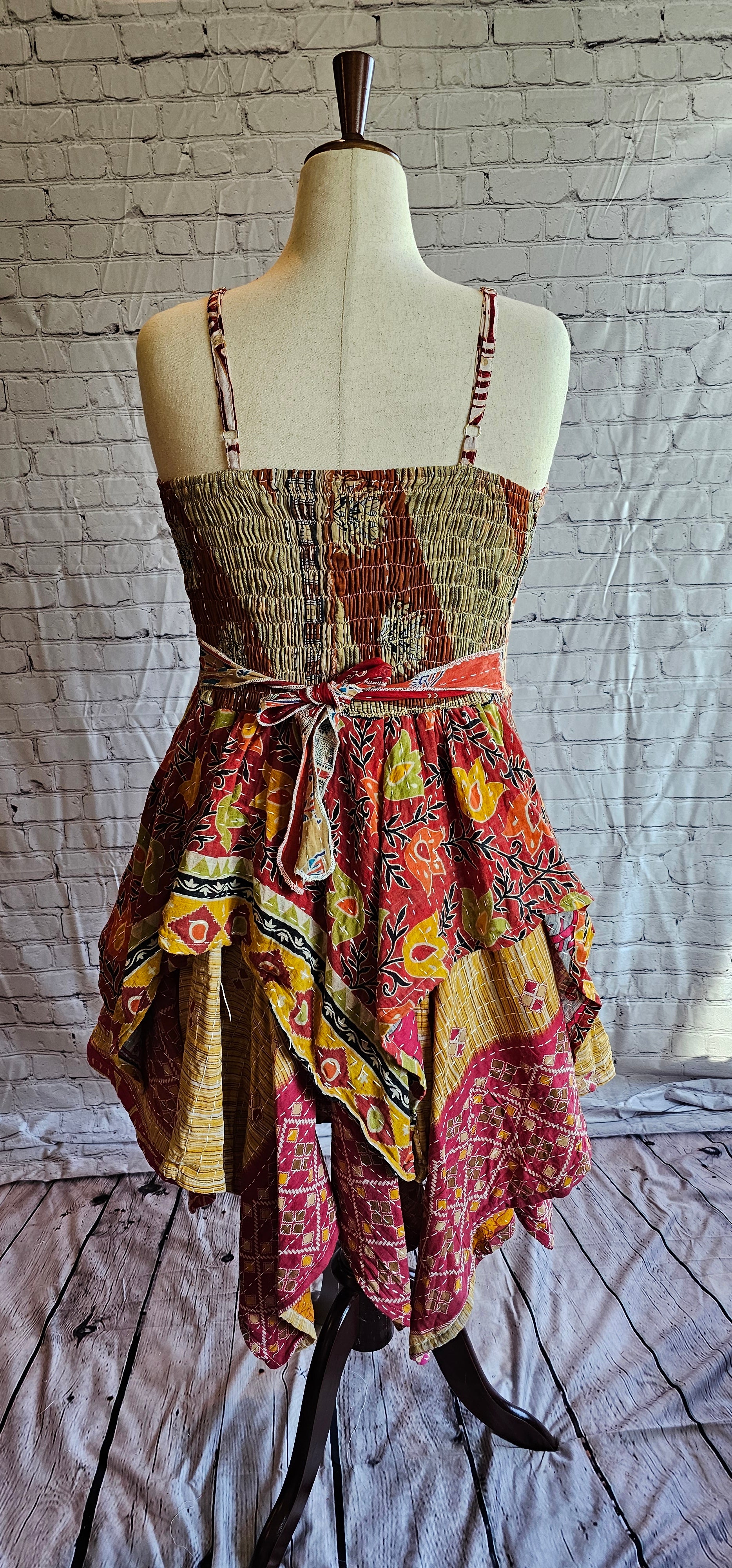 Back view of Krysta Kantha boho dress with handkerchief hem, recycled sari patchwork style