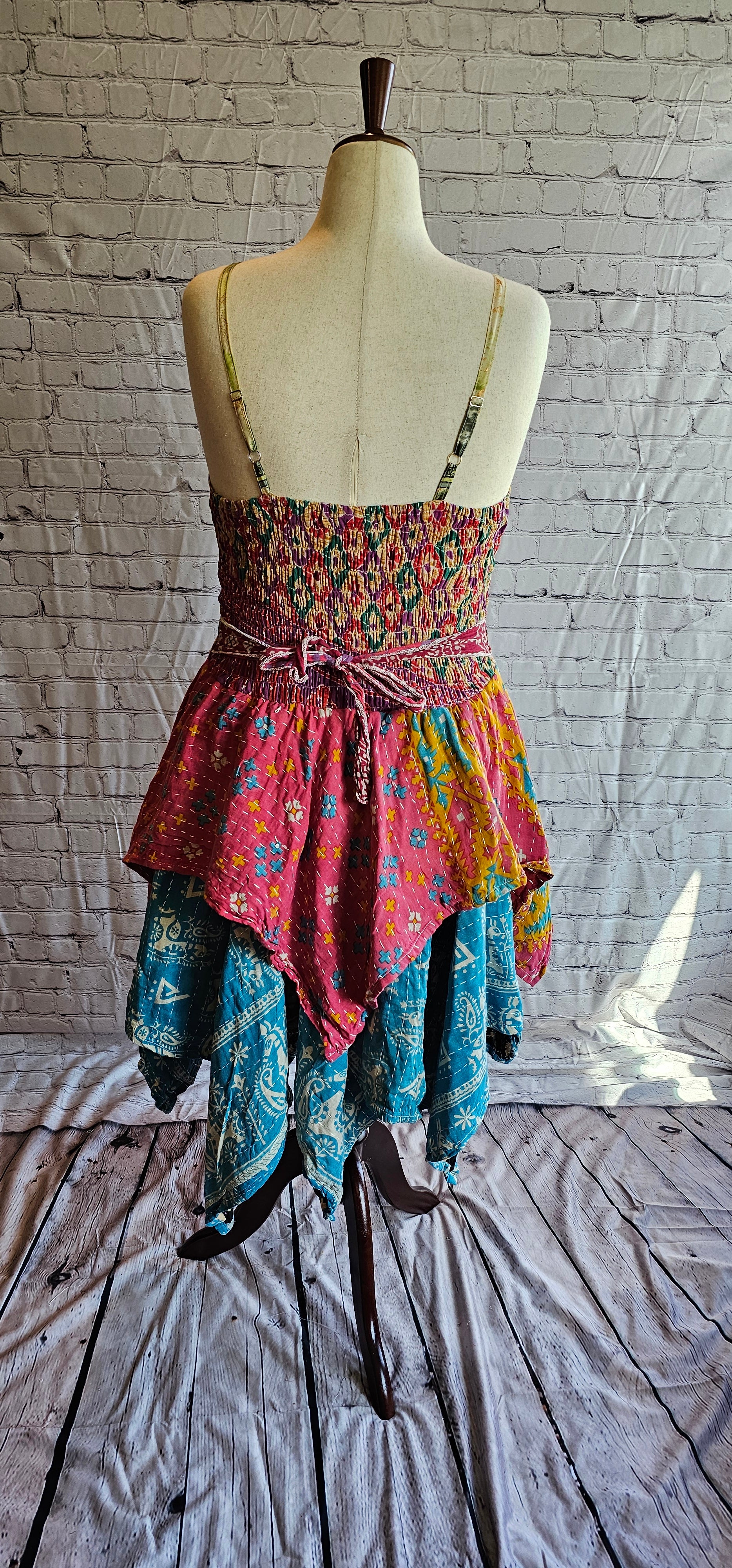 Krysta Kantha dress, back view highlighting bohemian patchwork and handkerchief hemline.