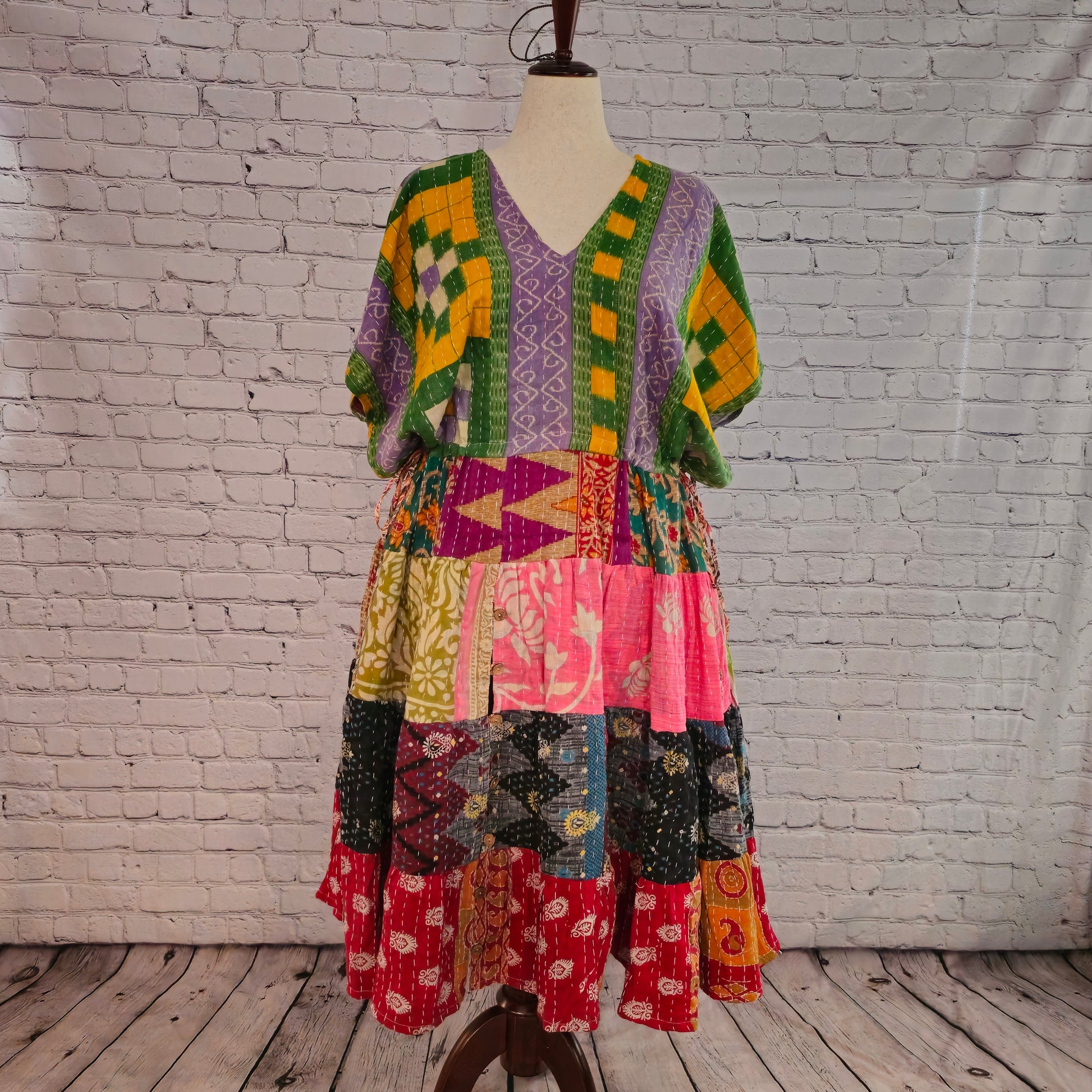 Twillow Spring Mosaic Kantha Midi Dress with green and lavender bodice and colorful patchwork skirt featuring Kantha stitching detail.