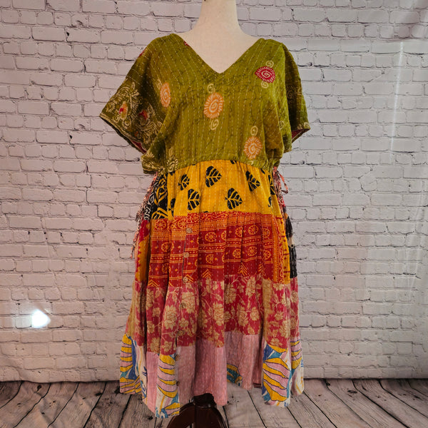 Twillow Harvest Glow Kantha Midi Dress with olive green bodice and warm yellow, red, and pink patchwork panels featuring Kantha stitching.