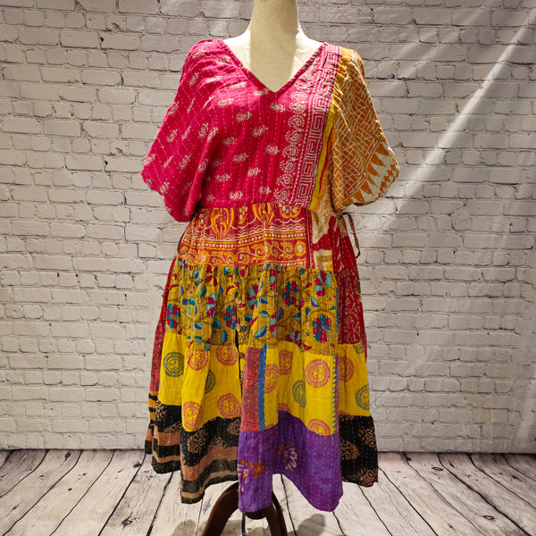 Twillow Festival Glow Kantha Midi Dress featuring pink and gold bodice with colorful patchwork skirt and traditional Kantha stitching.