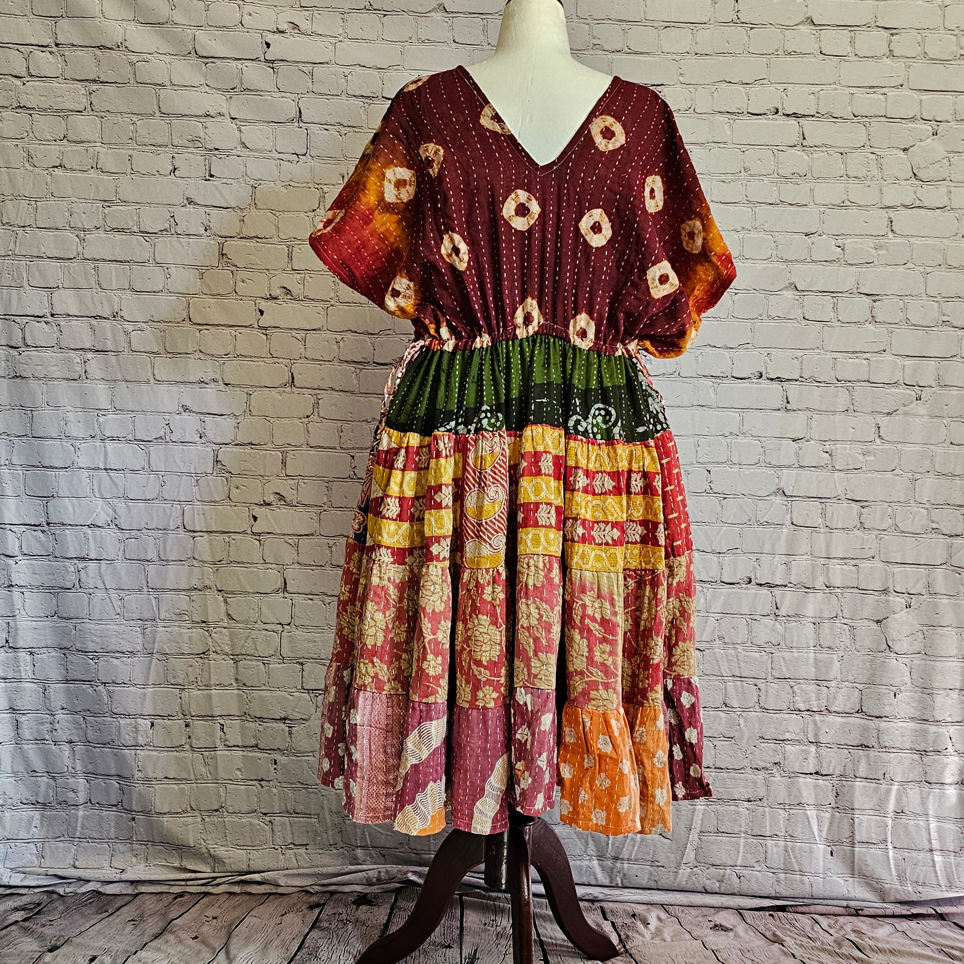 Twillow Sunset Reverie Kantha Midi Dress featuring maroon and multicolor boho patchwork panels, V-neck, and Kantha stitching accents.