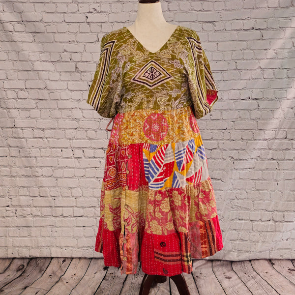 Twillow Nomad Bloom Kantha Midi Dress with olive geometric bodice and red, yellow, and blue patchwork skirt featuring Kantha stitching details.
