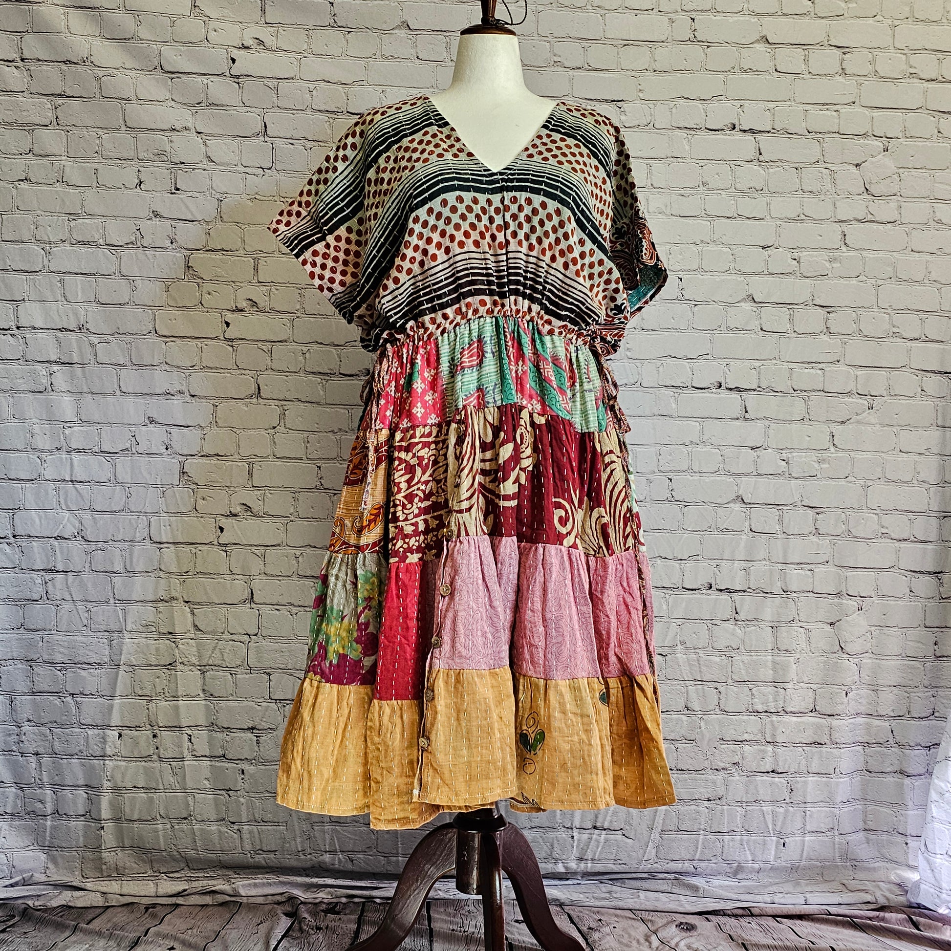 Twillow Desert Bloom Kantha Midi Dress with striped and dotted bodice, multicolor patchwork skirt, and Kantha stitching detail.