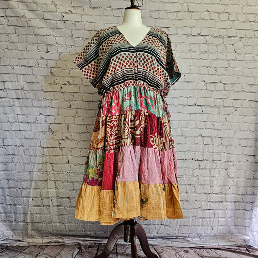 Twillow Desert Bloom Kantha Midi Dress with striped and dotted bodice, multicolor patchwork skirt, and Kantha stitching detail.
