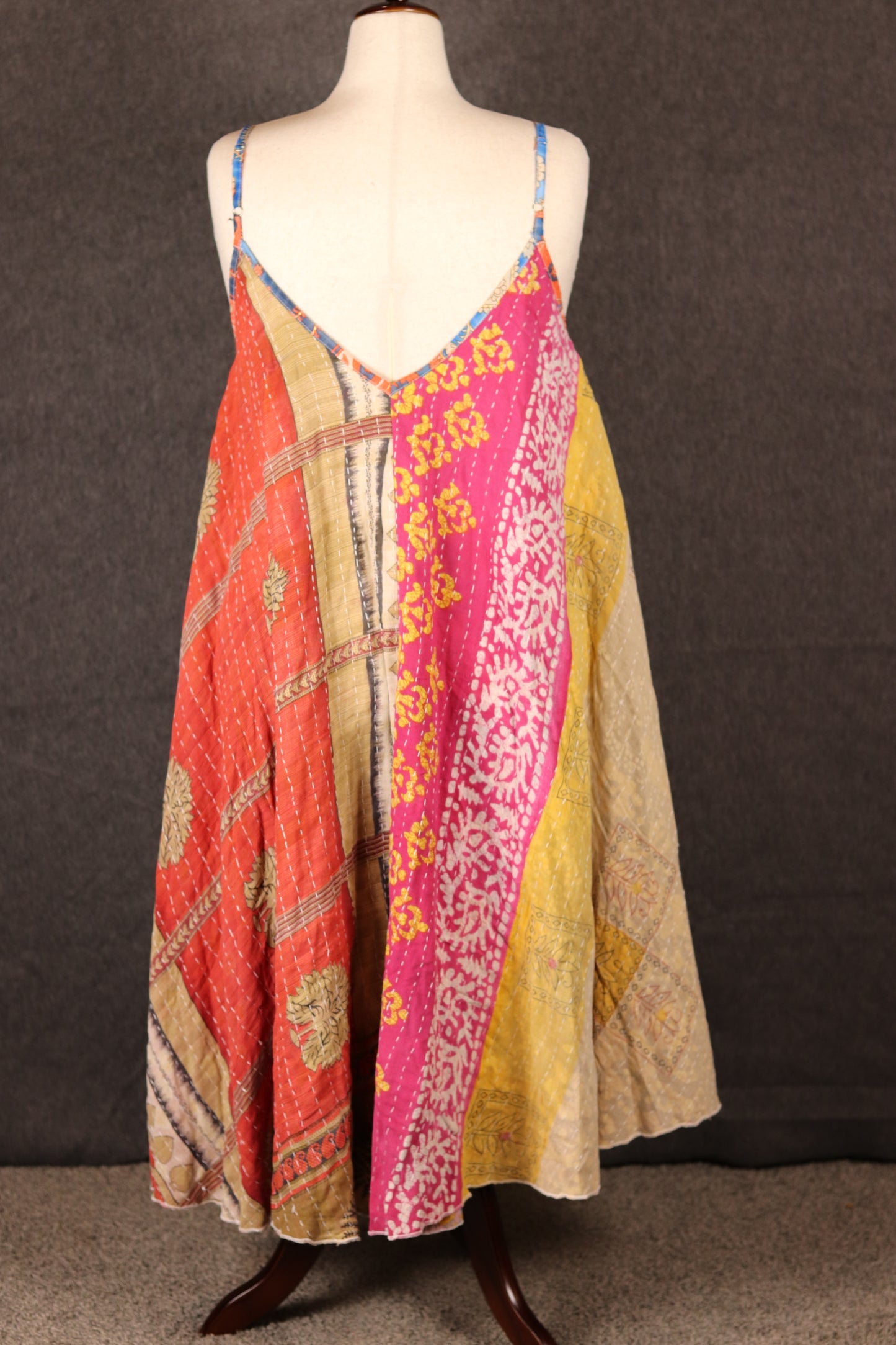 Back-facing image of Sora bohemian Kantha dress on mannequin, sustainable patchwork style.
