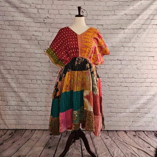 Twillow Harvest Ember Kantha Midi Dress with a burgundy and golden top and a vibrant patchwork skirt in teal, amber, rose, and black, accented with Kantha stitching.