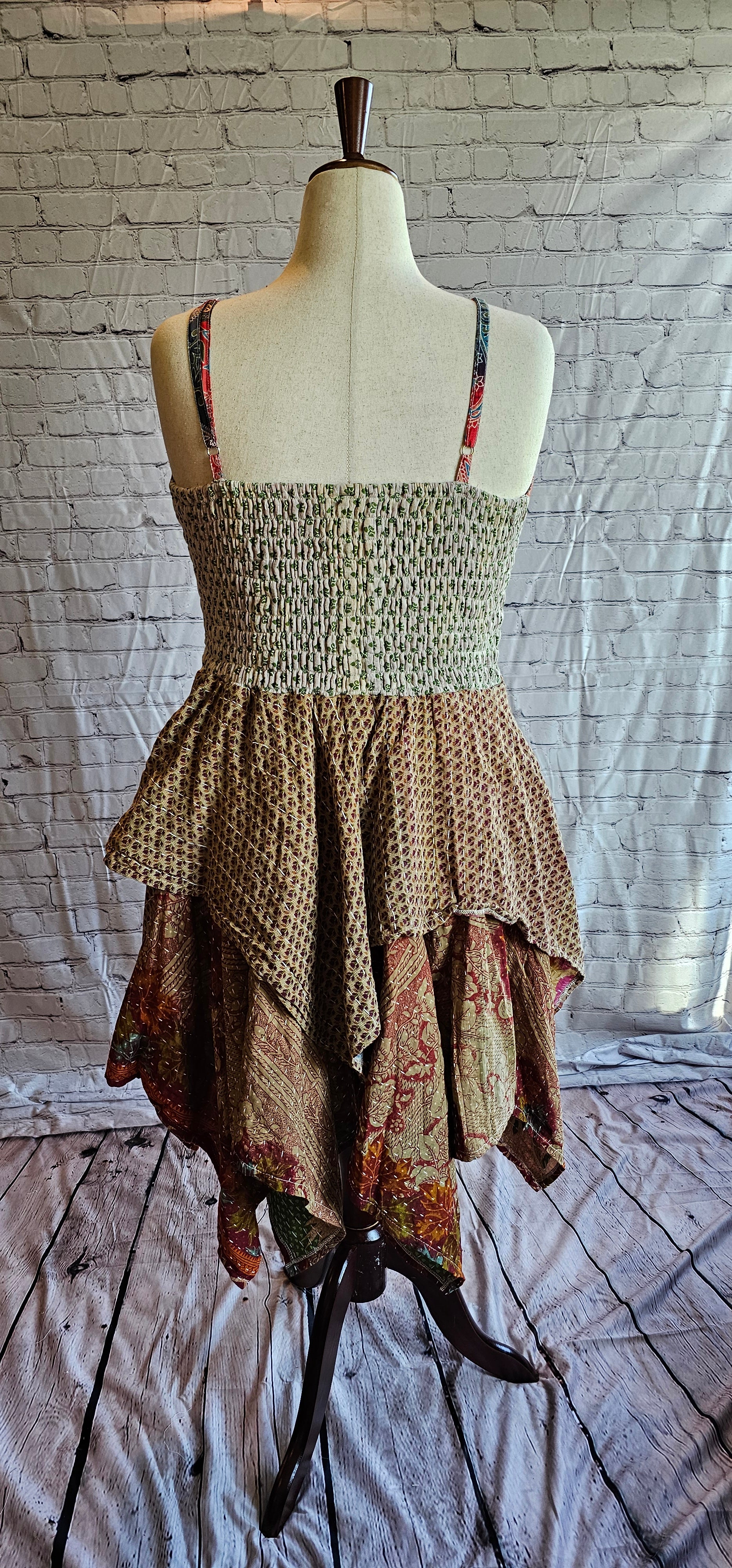 Back-facing image of Krysta boho Kantha dress, recycled sari fabric with tiered skirt flow