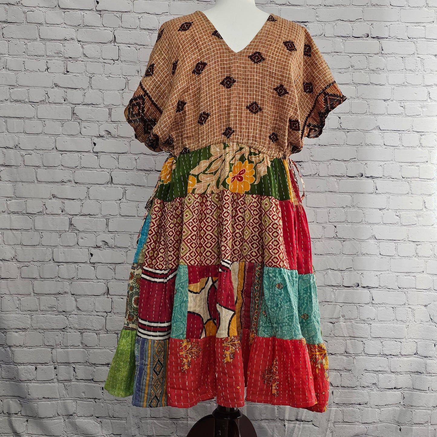 Twillow Meadow Mosaic Kantha Dress featuring colorful boho patchwork panels, Kantha stitching, and a relaxed V-neck silhouette.