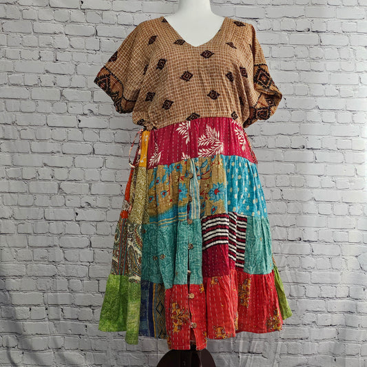 Twillow Meadow Mosaic Kantha Dress featuring colorful boho patchwork panels, Kantha stitching, and a relaxed V-neck silhouette.