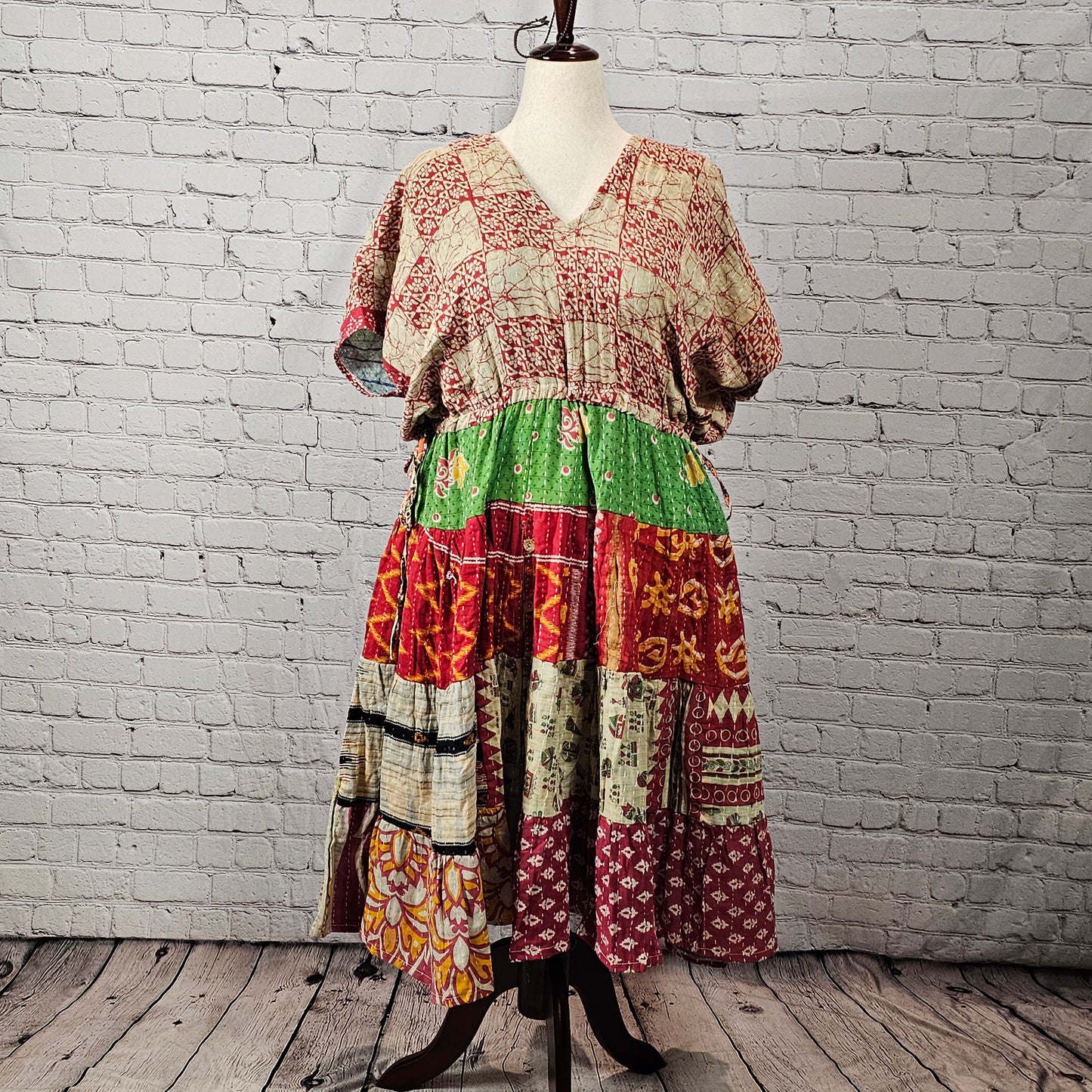 Rustic red and cream Twillow Woodland Patchwork Kantha Midi Dress with green, gold, and berry patchwork skirt and visible Kantha stitching.