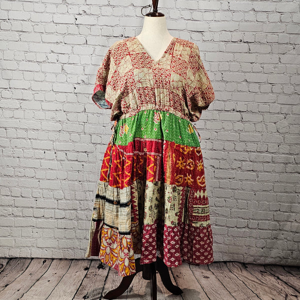 Rustic red and cream Twillow Woodland Patchwork Kantha Midi Dress with green, gold, and berry patchwork skirt and visible Kantha stitching.