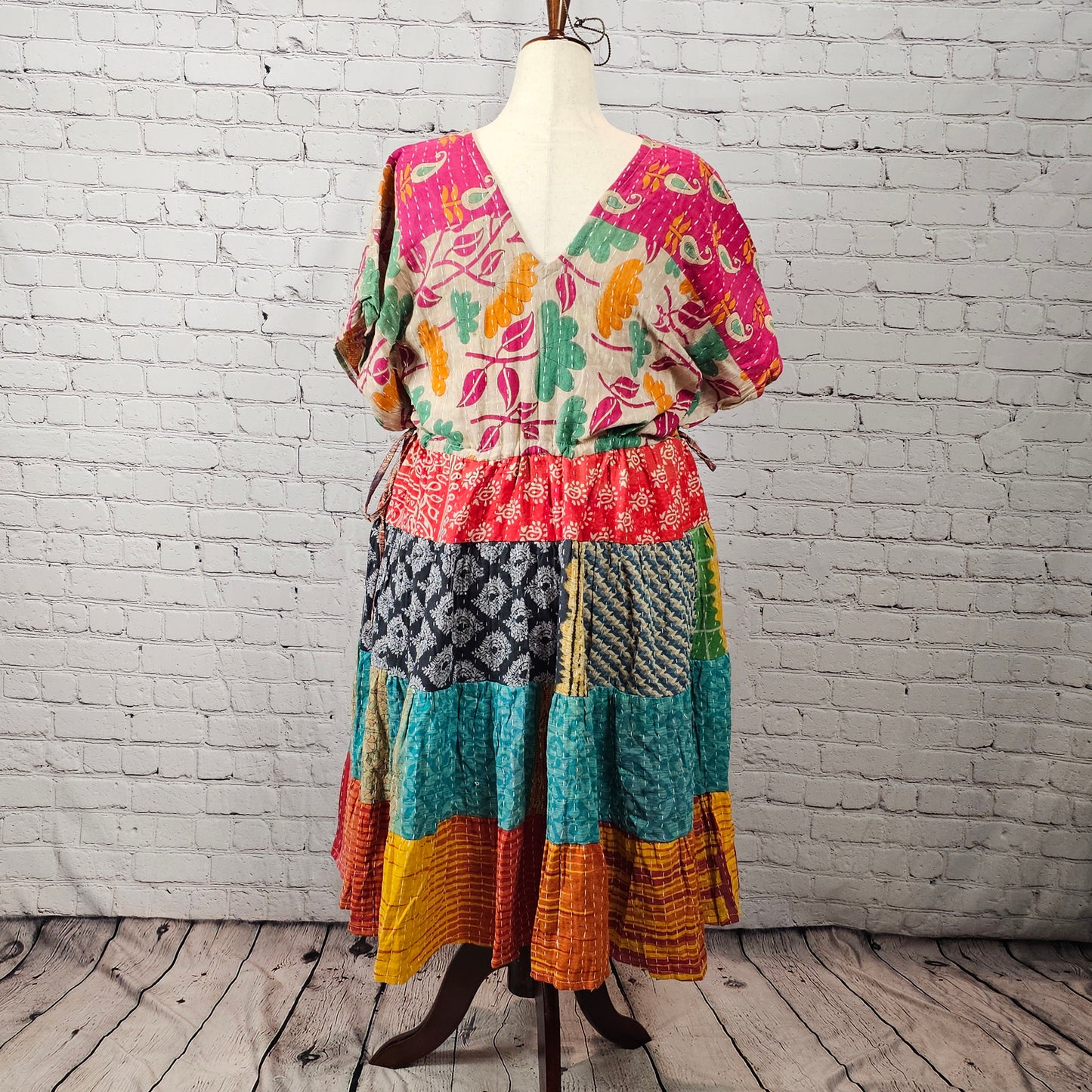 Bright fuchsia floral Twillow Kantha Midi Dress with teal, coral, mustard, and red patchwork skirt and Kantha stitching.