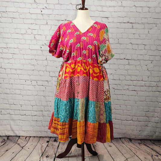 Bright fuchsia floral Twillow Kantha Midi Dress with teal, coral, mustard, and red patchwork skirt and Kantha stitching.