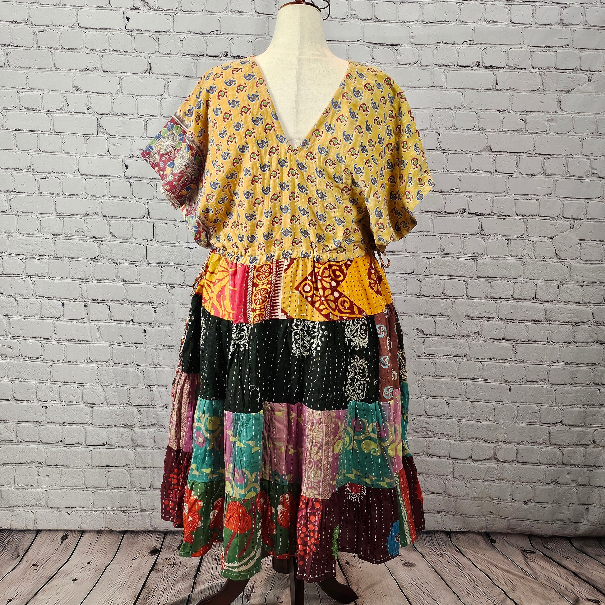Yellow floral Twillow Kantha Midi Dress with a multicolor patchwork skirt in green, purple, blue, red, and teal featuring Kantha stitching.
