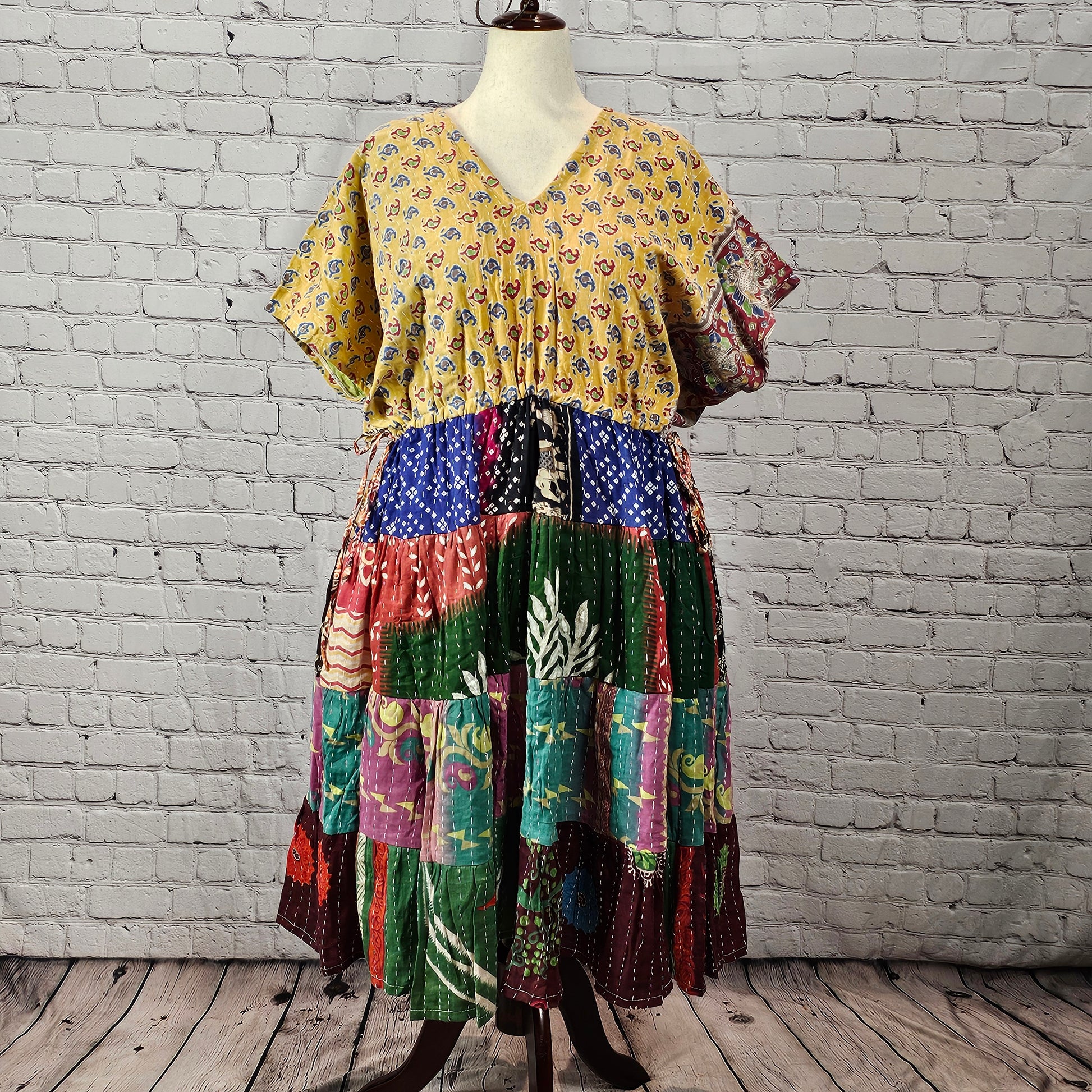 Yellow floral Twillow Kantha Midi Dress with a multicolor patchwork skirt in green, purple, blue, red, and teal featuring Kantha stitching.