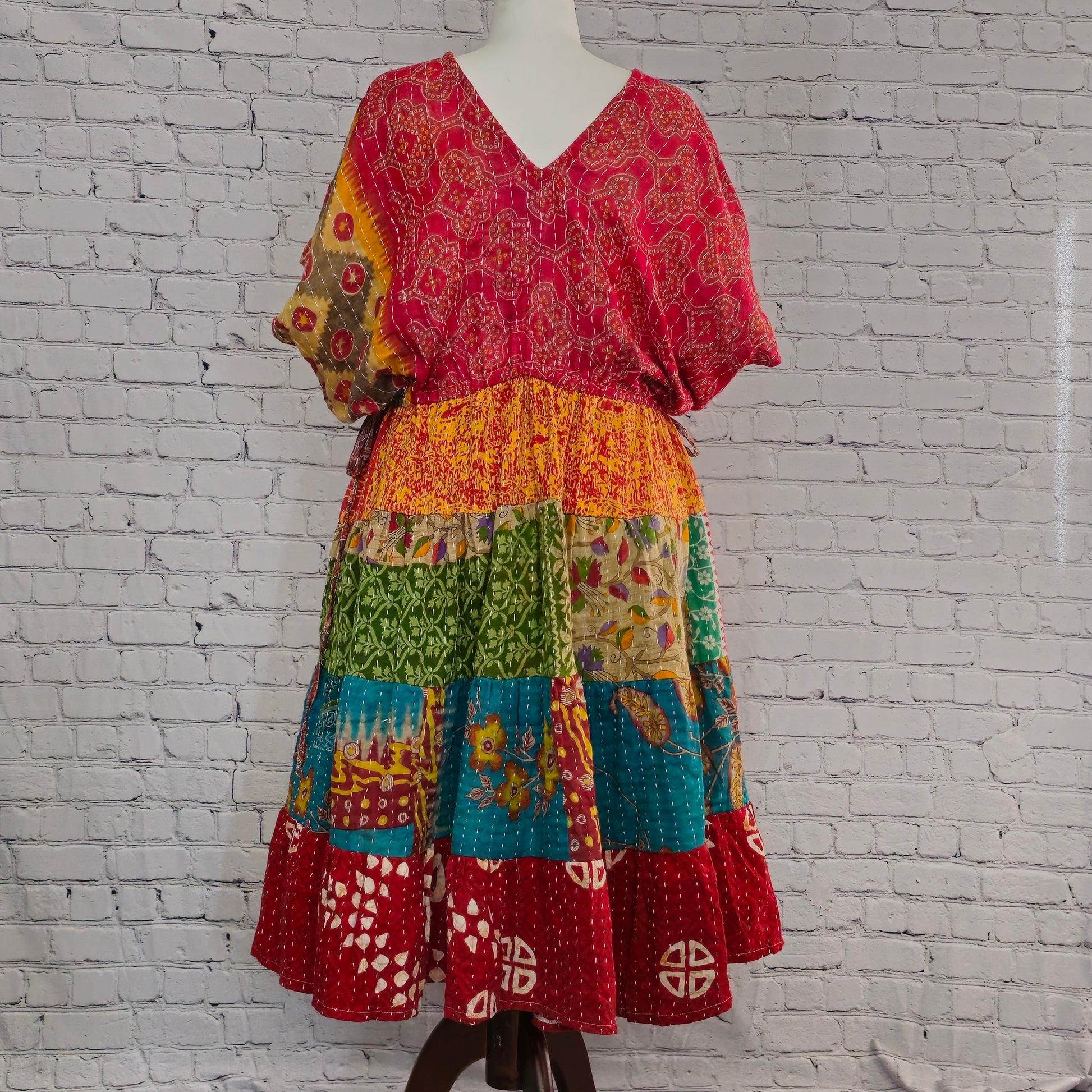Twillow Crimson Sol Kantha Midi Dress with red, gold, and teal patchwork panels and Kantha stitching detail, featuring a relaxed boho fit.