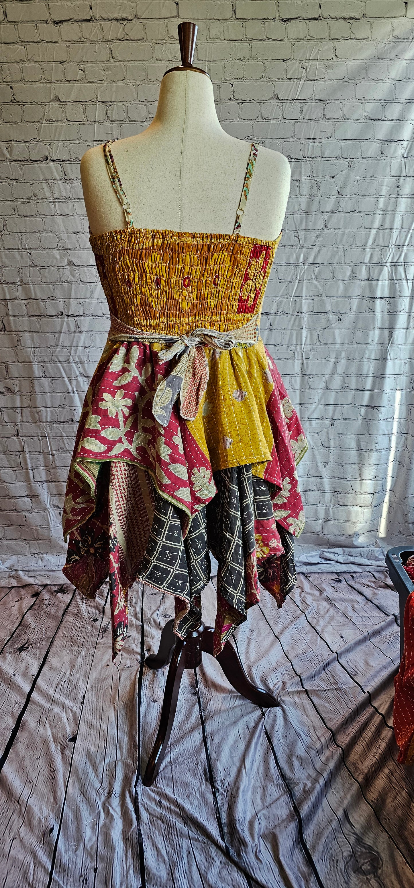 Back view of Krysta Kantha boho dress with handkerchief hem, recycled sari patchwork style