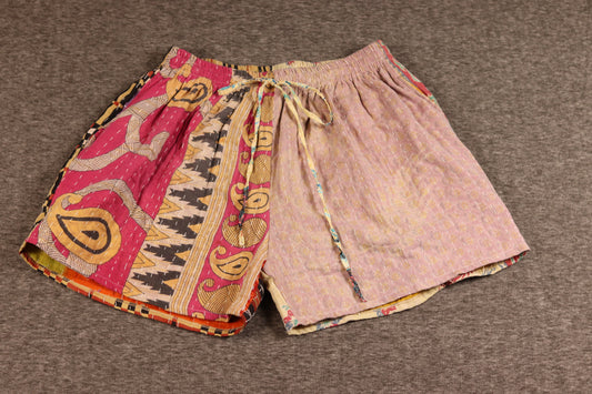 Unisex Kantha shorts with rose, magenta, and golden cotton panels featuring paisley and geometric prints, detailed with Kantha stitching and a drawstring waist.