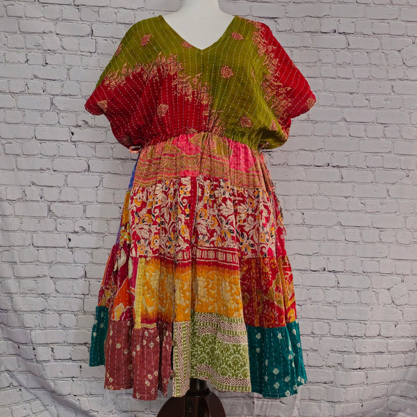 Twillow Solstice Bloom Kantha Midi Dress featuring olive-green and red bodice with multicolor patchwork skirt and Kantha stitching detail.
