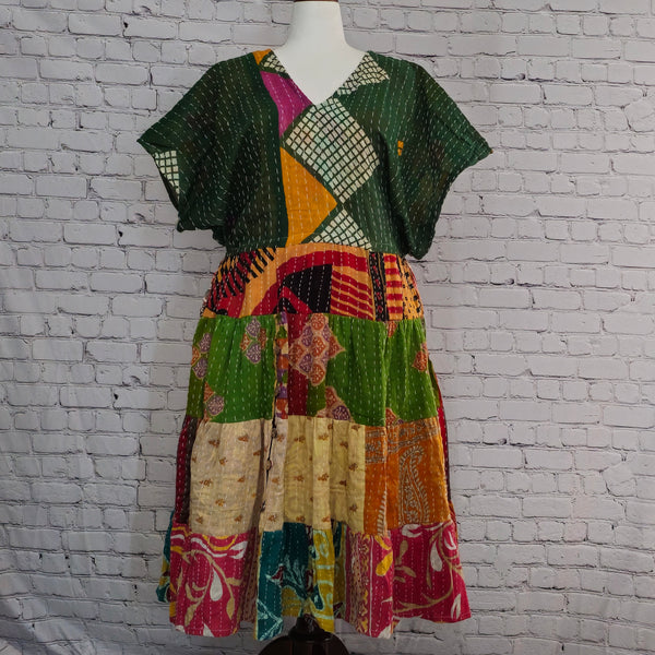 Twillow Verdant Muse Kantha Midi Dress featuring green geometric bodice and colorful patchwork skirt with Kantha stitching detail.