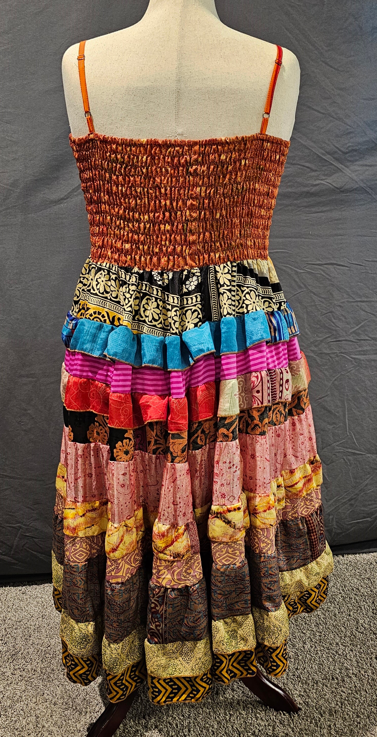 Sustainable sari dress, related to Kantha tradition of reusing textiles with artistry.