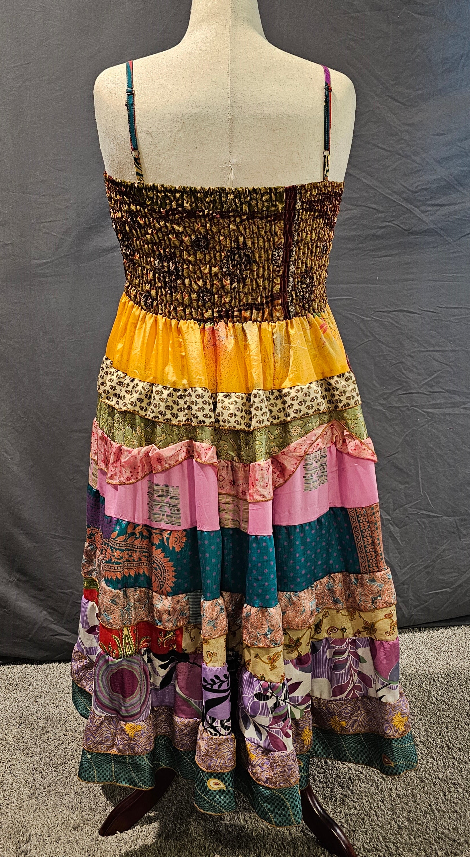 Boho recycled sari dress with vibrant patterns and adaptable fit.