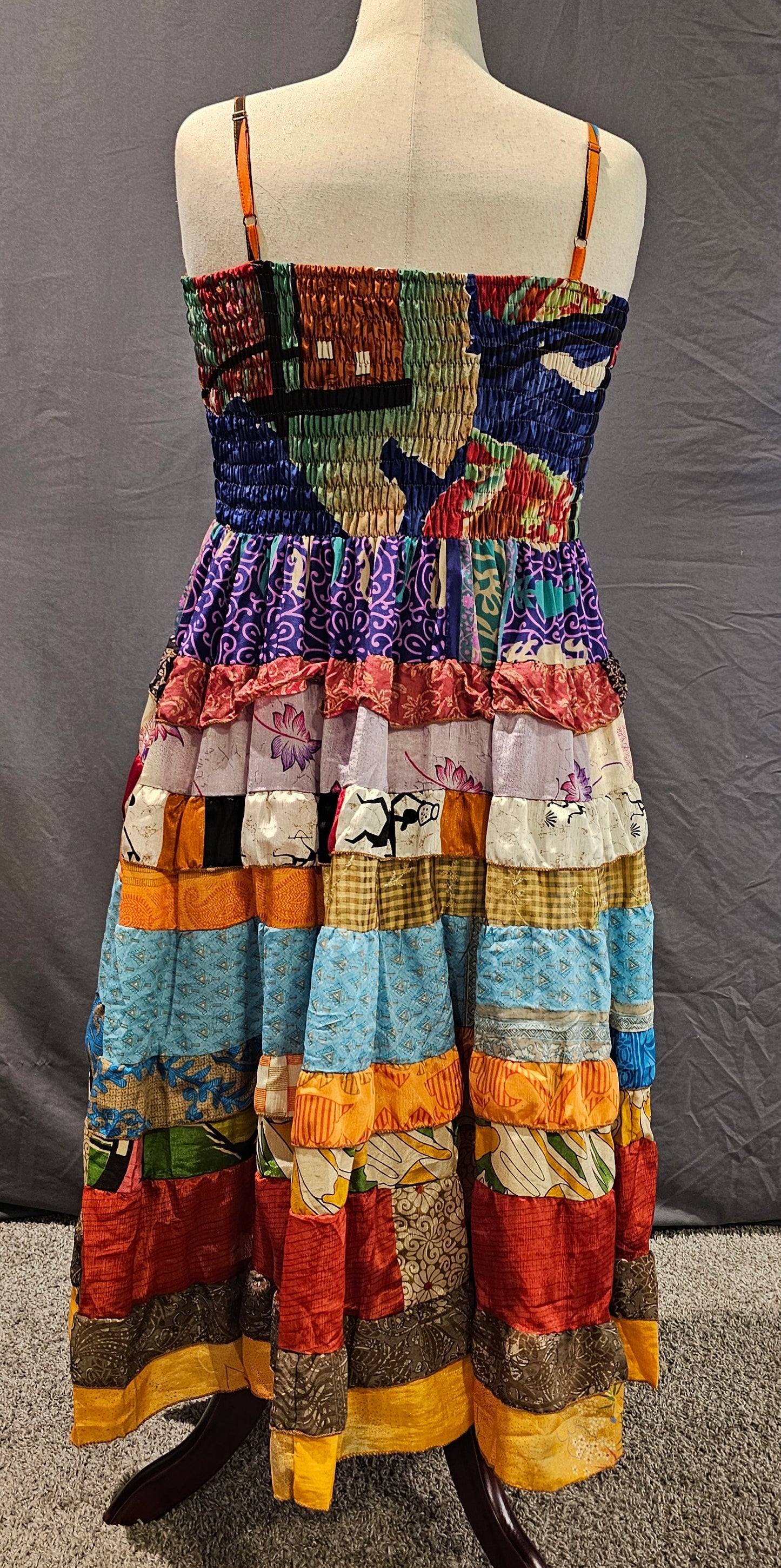 Size-inclusive boho dress made from recycled sari textiles, designed to flatter every body.