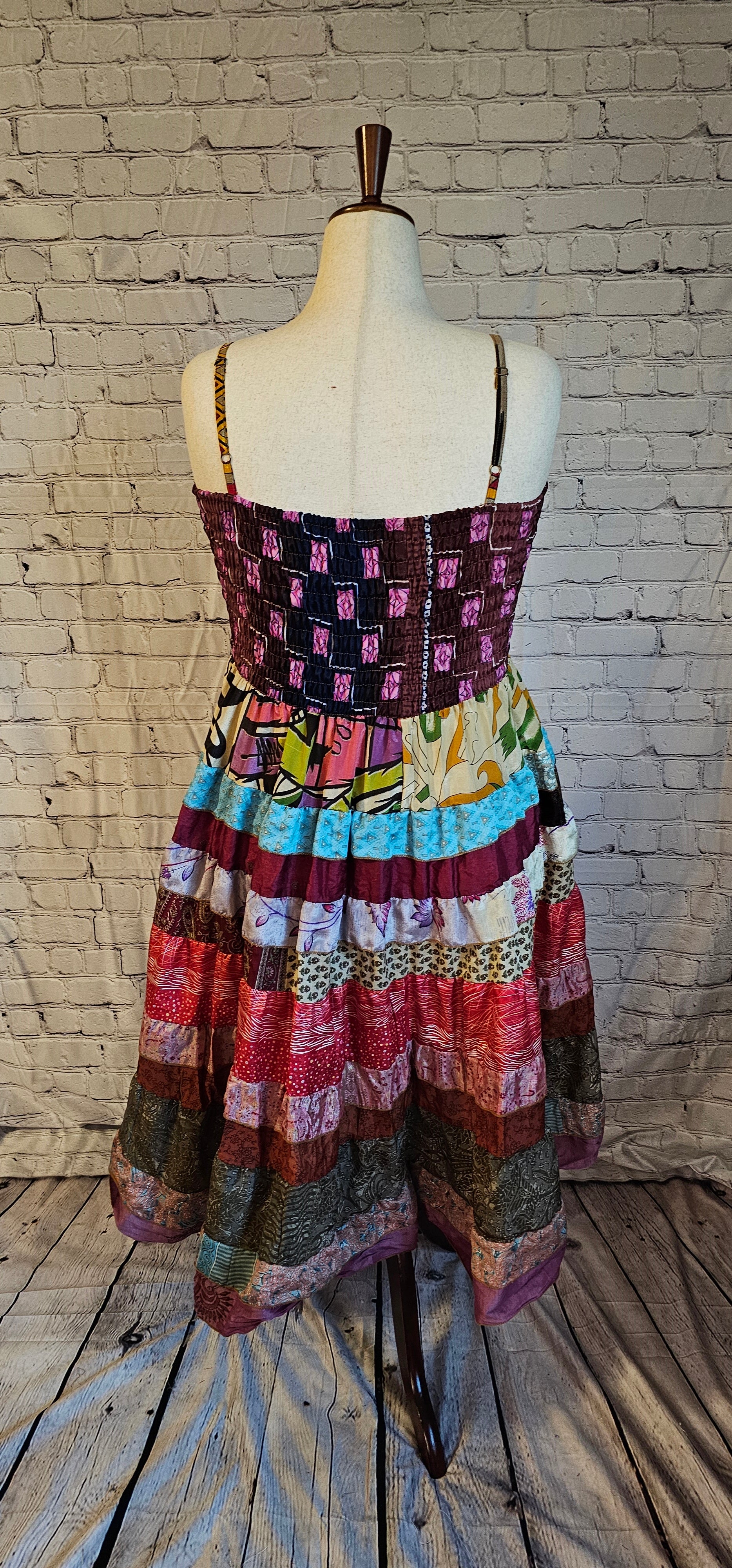 Upcycled sari dress back in vibrant colors, part of Wild Kantha’s artisan clothing collection.