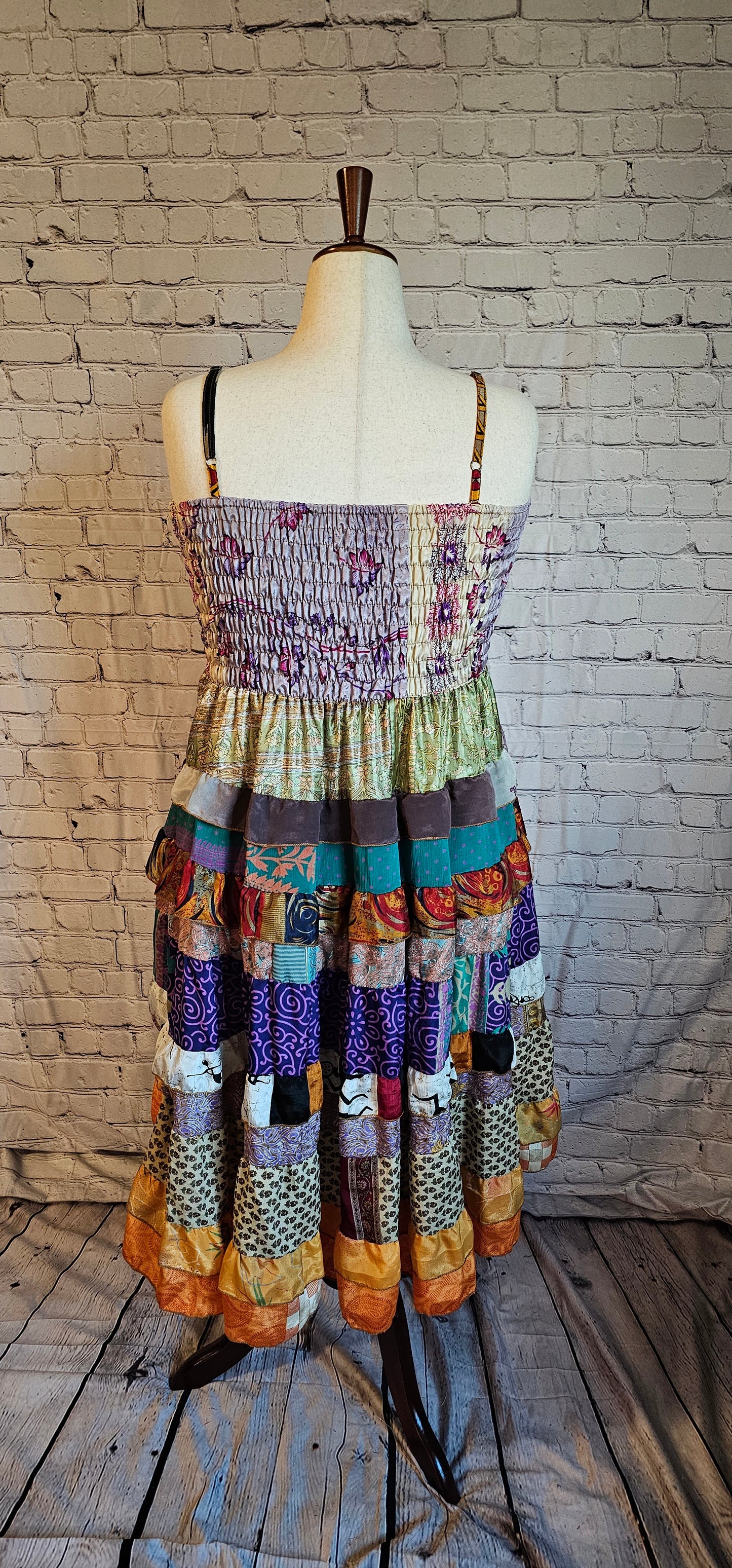 Sustainable Meadowlark sari dress back with unique recycled textile patchwork.
