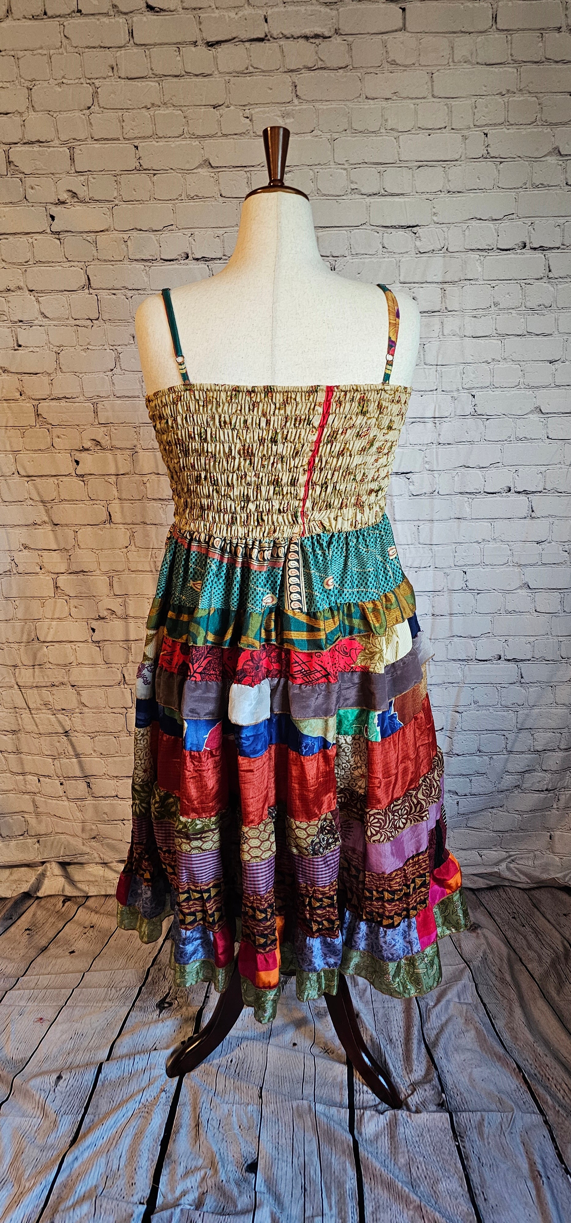 Upcycled sari dress back from Wild Kantha, blending heritage textiles with modern inclusive design.