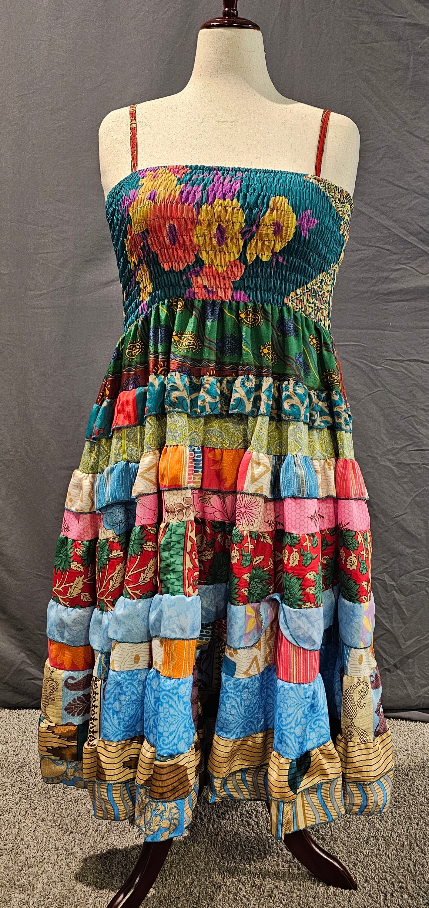 Upcycled sari dress front in vibrant colors, part of Wild Kantha’s artisan clothing collection.