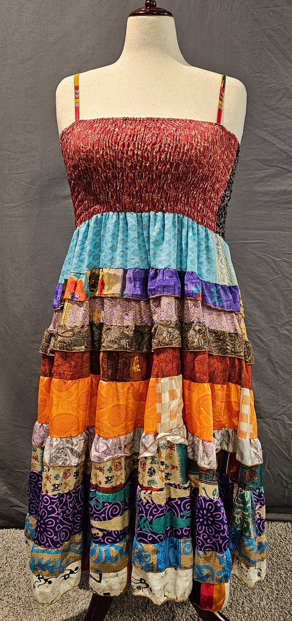 Meadowlark boho patchwork tiered dress in maroon, orange, and blue, one-of-a-kind sustainable fashion.