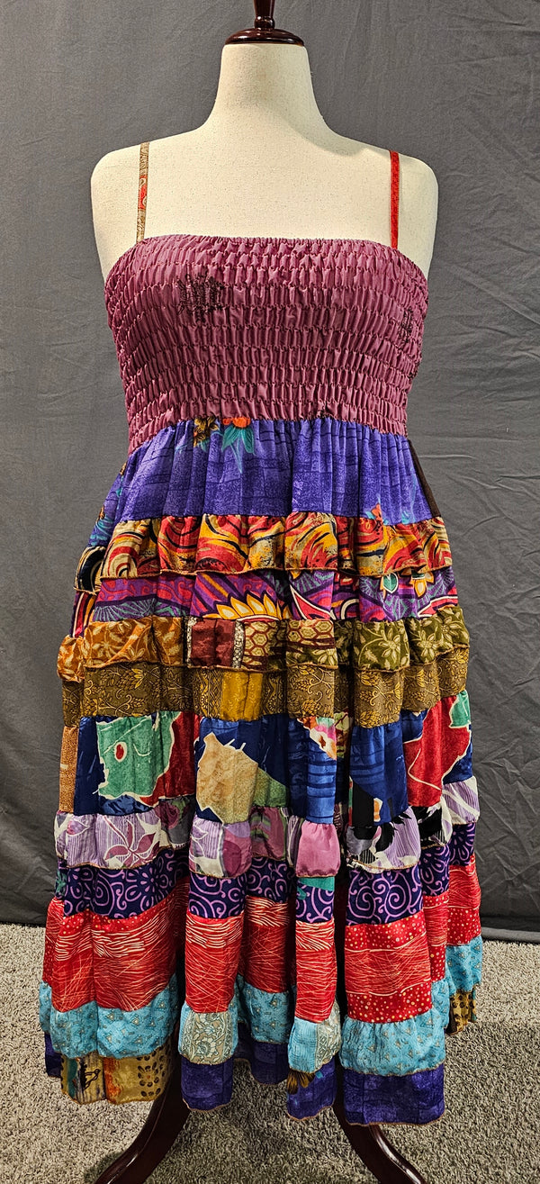 Meadowlark boho patchwork tiered dress in berry, violet, and gold, one-of-a-kind sustainable fashion.