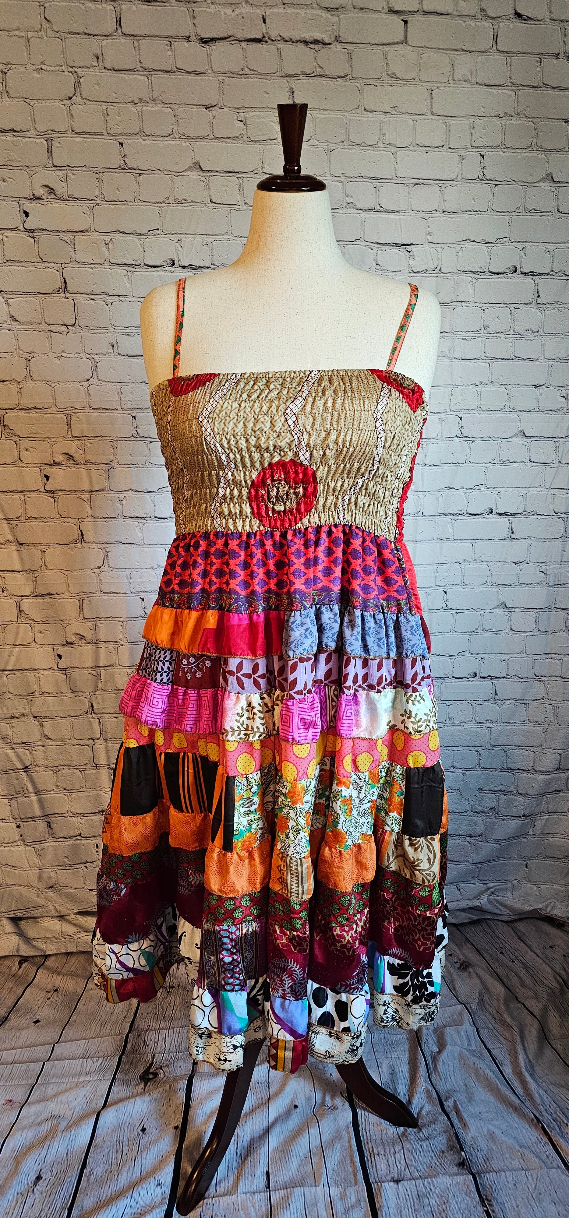 Size-inclusive boho dress front made from recycled sari textiles, designed to flatter every body.
