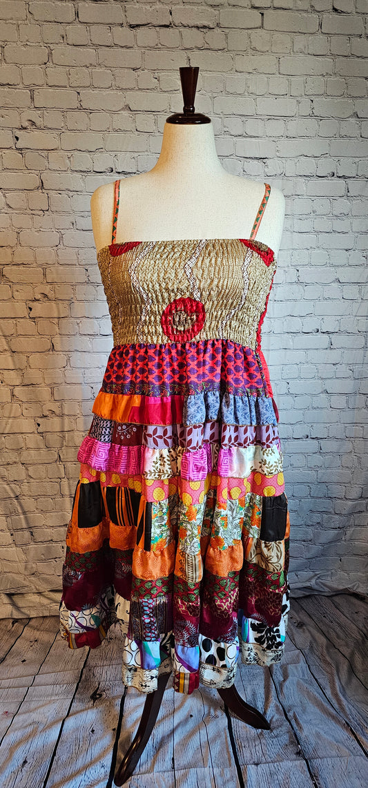 Size-inclusive boho dress front made from recycled sari textiles, designed to flatter every body.
