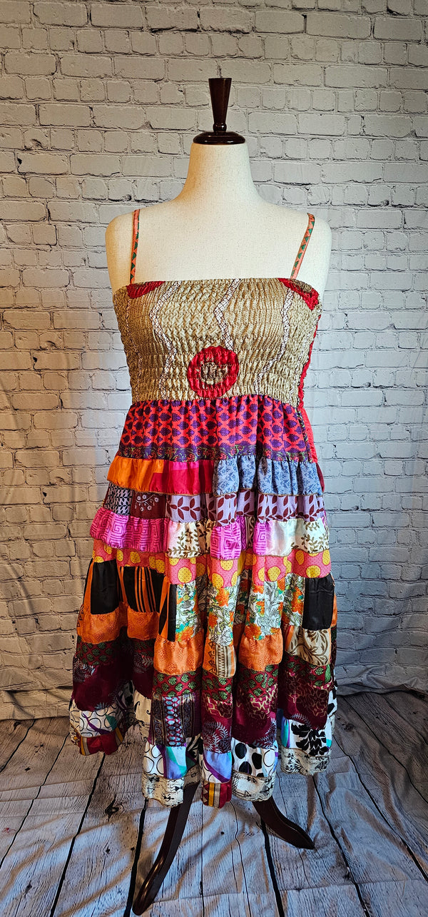 Size-inclusive boho dress front made from recycled sari textiles, designed to flatter every body.
