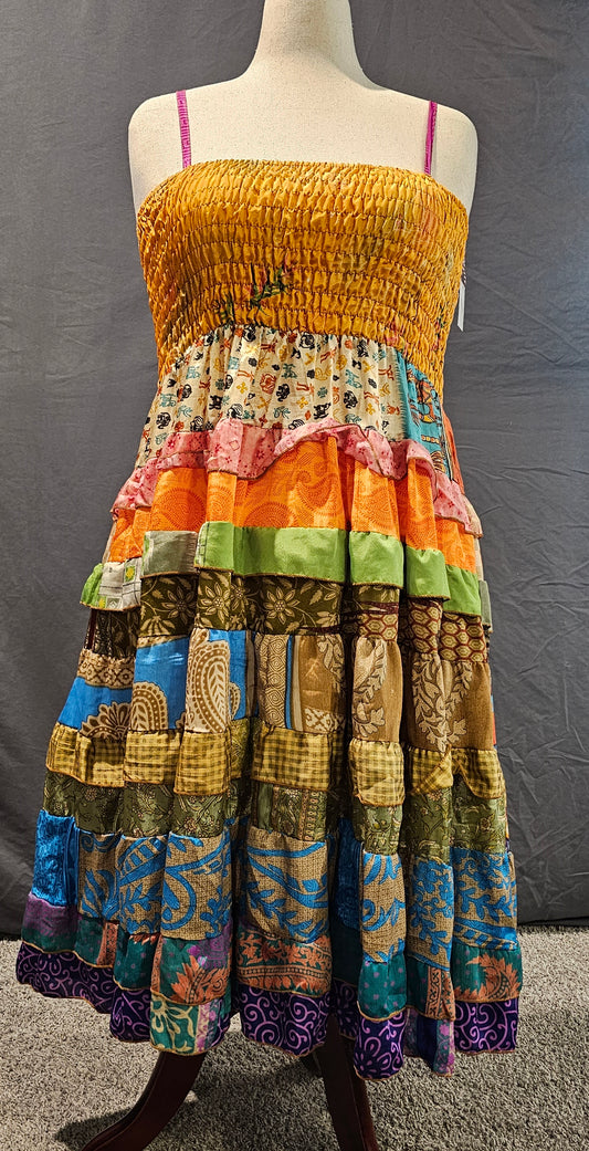 Boho recycled sari dress, handmade from upcycled textiles for sustainable style shown on mannequin.