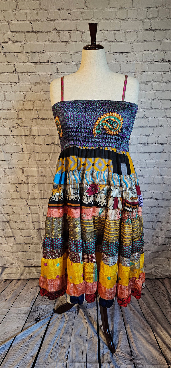 Eco-friendly boho fashion — Meadowlark recycled sari dress with unique patchwork design shown on mannequin.
