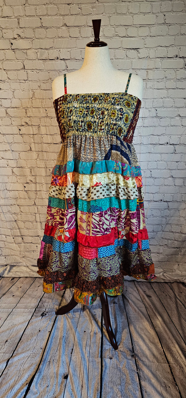 Boho maxi dress made from recycled sari, flowy and unique sustainable clothing shown on mannequin.