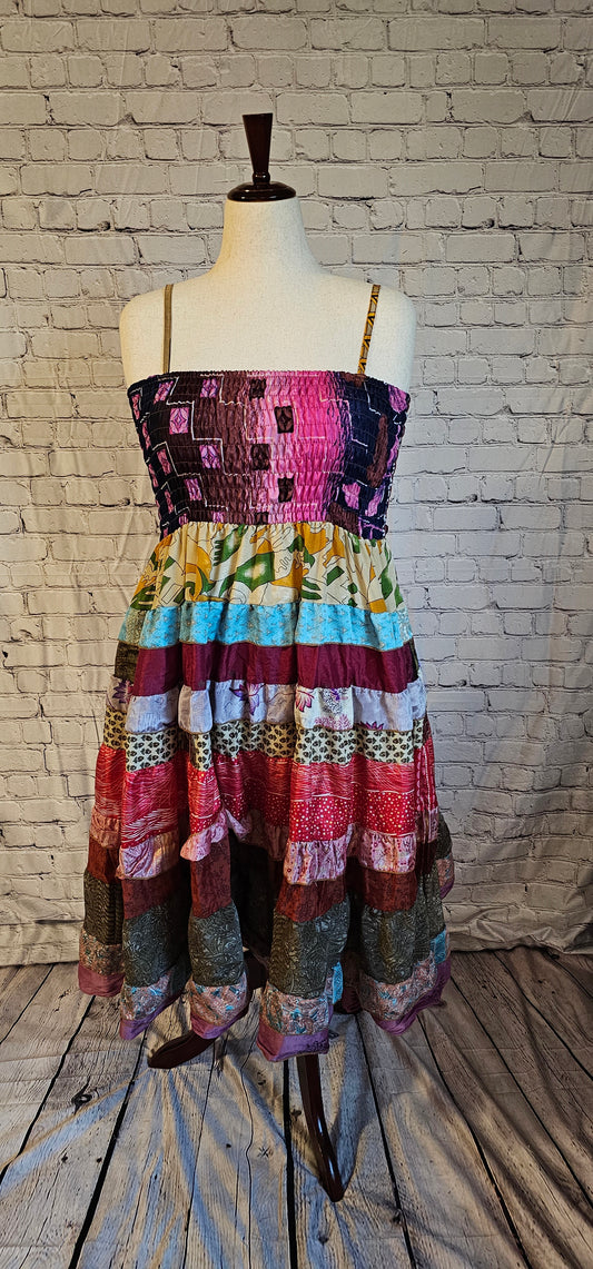 Bohemian sari dress with adaptable fit for pregnancy, postpartum, or body changes shown on mannequin.