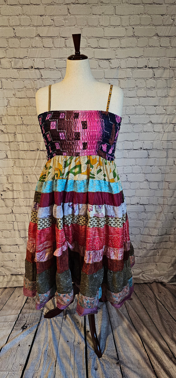 Bohemian sari dress with adaptable fit for pregnancy, postpartum, or body changes shown on mannequin.