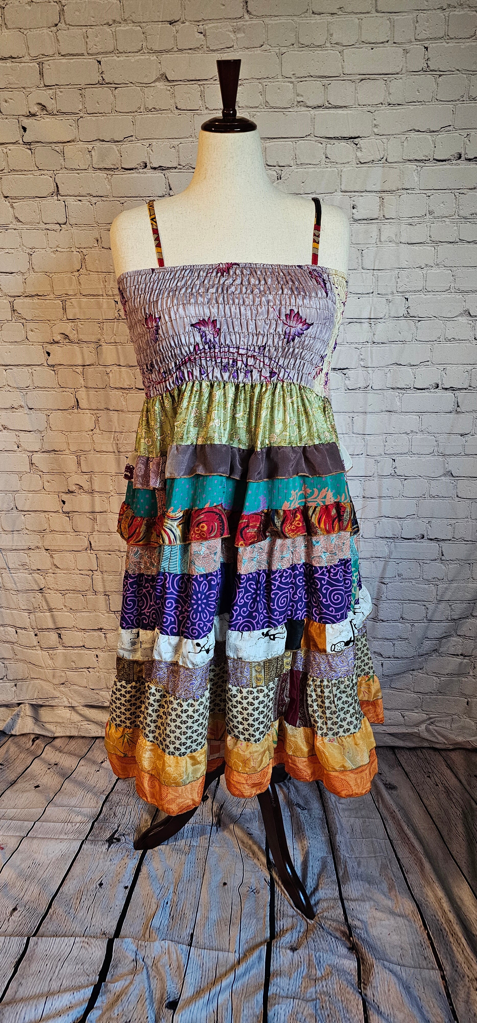 Flowy boho recycled sari dress designed to move with your life and body shown on mannequin.