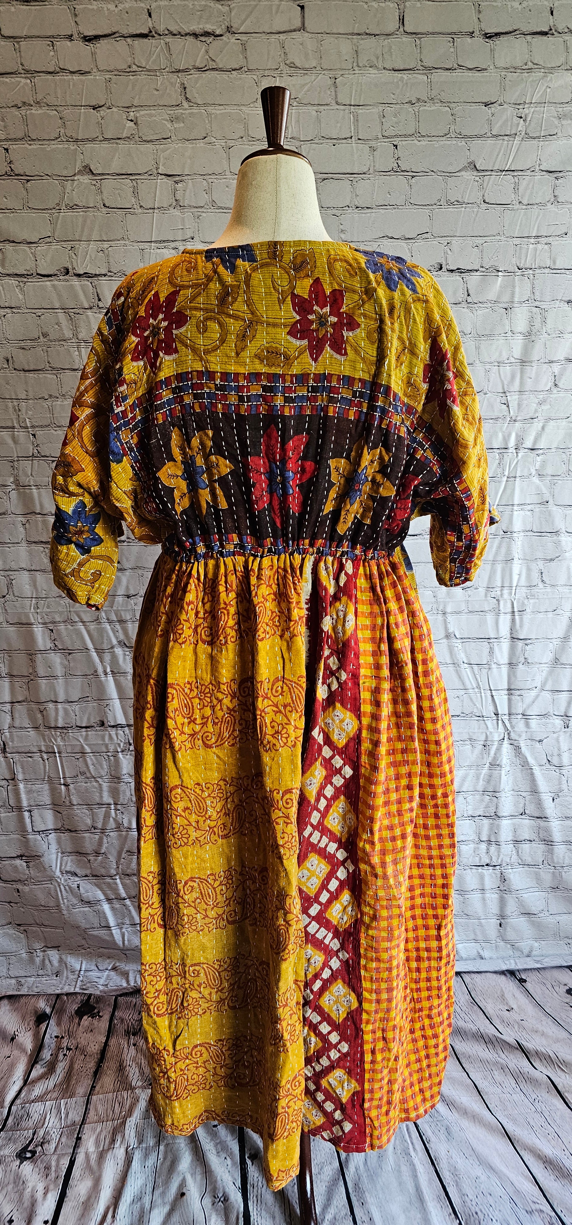 Sustainable cotton Kantha patchwork dress, one-of-a-kind boho fashion shown on mannequin.