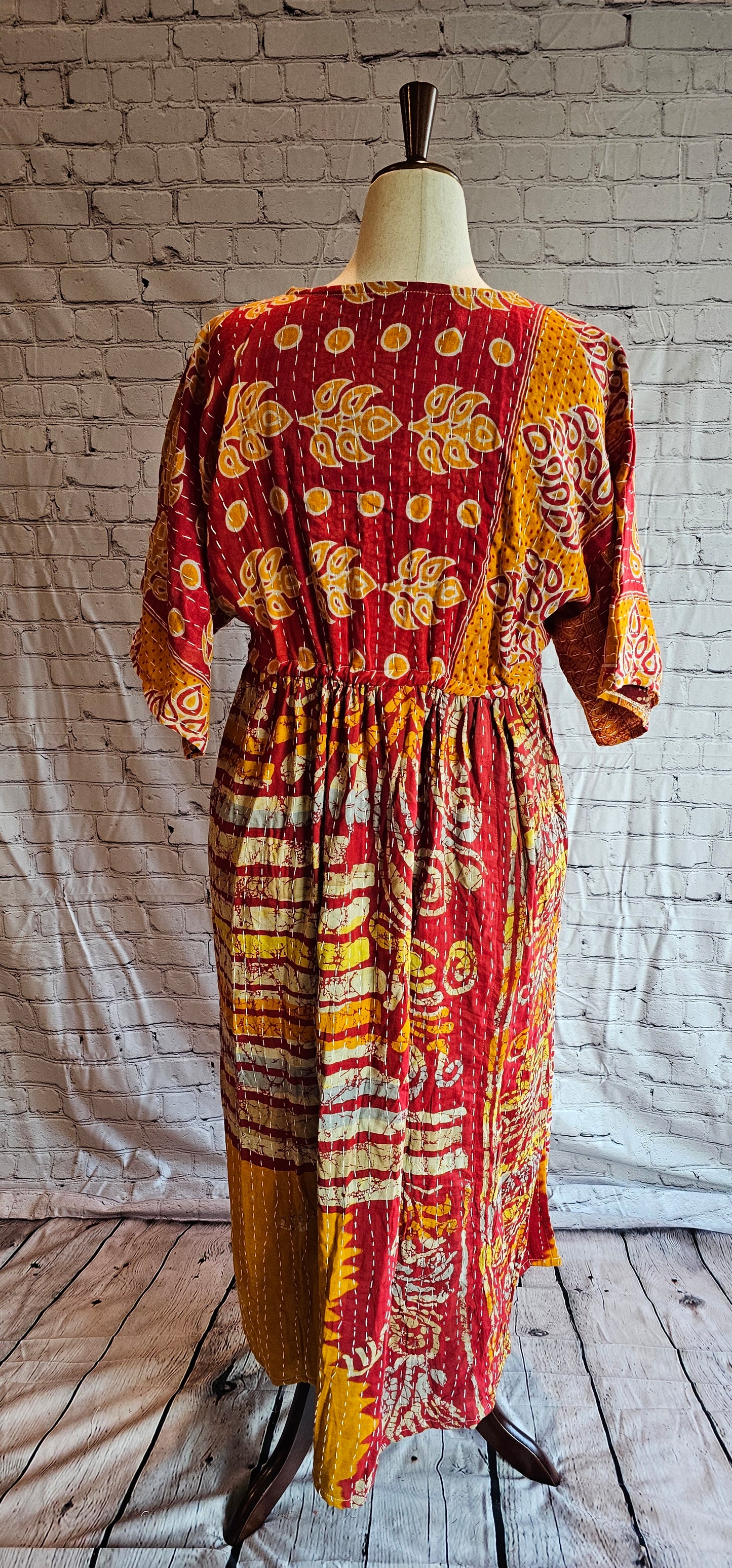 Bohemian cotton Kantha dress with free-size adaptable fit shown on mannequin.